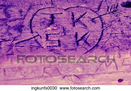Stock Image - Graffiti on Picnic Table. Fotosearch