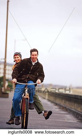 Man Doubling Woman on Bike on Boardwalk View Large Photo Image Stock Photo - Man Doubling Woman on Bike on Boardwalk. Fotosearch