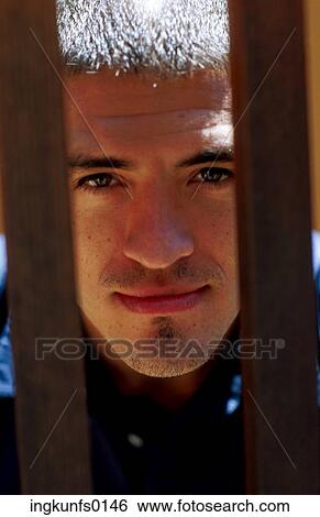 Man's Face Between Two Bars View Large Photo Image Stock Photograph - Man's Face Between Two Bars. Fotosearch