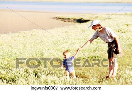 Mother and child in Field View Large Photo Image Stock Photo - Mother and child in Field. Fotosearch