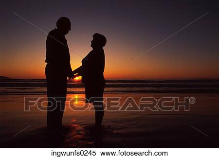 Old Couple at the Beach at Sunset View Large Photo Image Stock Photography - Old Couple at the Beach at Sunset. Fotosearch