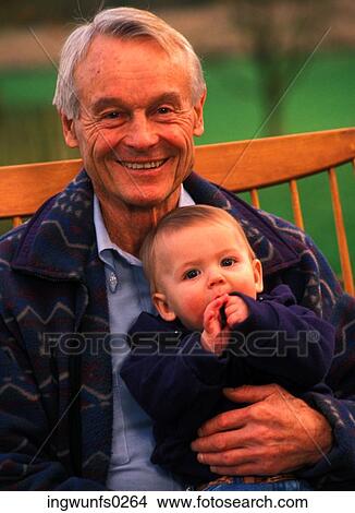 Picture - Old Man Holding Baby. Fotosearch