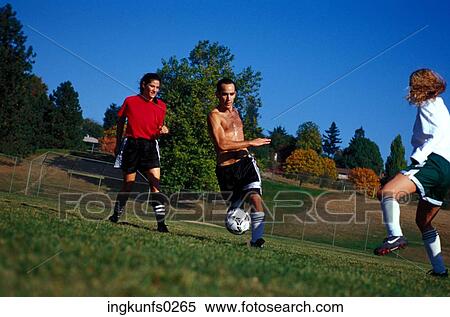 Stock Photography - Playing Soccer. Fotosearch