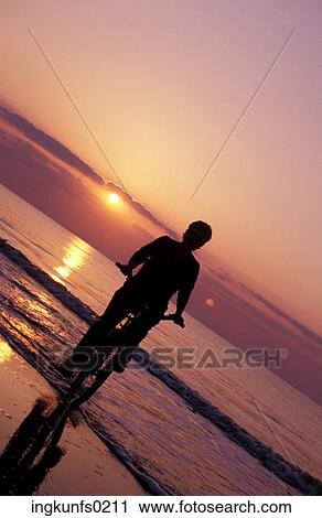 Riding a Bike on the Beach View Large Photo Image Stock Image - Riding a Bike on the Beach. Fotosearch
