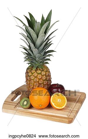 assorted fruits on cutting board View Large Photo Image Picture - assorted fruits on cutting board . Fotosearch