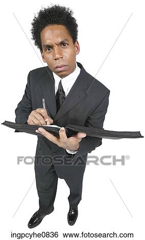 Business man with a book View Large Photo Image Stock Photograph - Business man with a book . Fotosearch