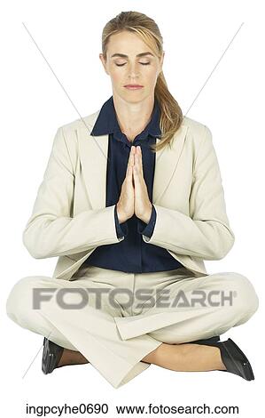 Stock Image - Business woman meditating . Fotosearch