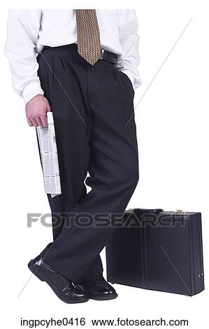 Businessman standing beside briefcase View Large Photo Image Stock Photograph - Businessman standing beside briefcase . Fotosearch