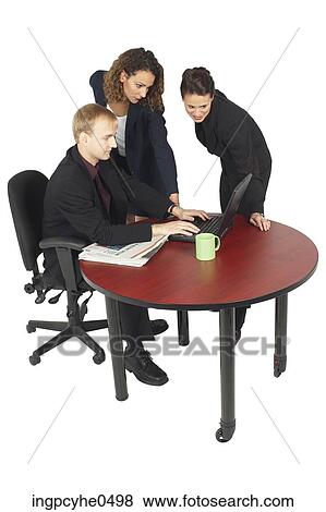 Businesspeople using laptop View Large Photo Image Stock Photo - Businesspeople using laptop . Fotosearch