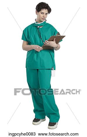 Stock Image - Doctor reading her clipboard . Fotosearch