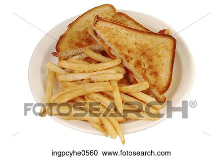 Stock Image - Grilled cheese sandwich and French fries . Fotosearch