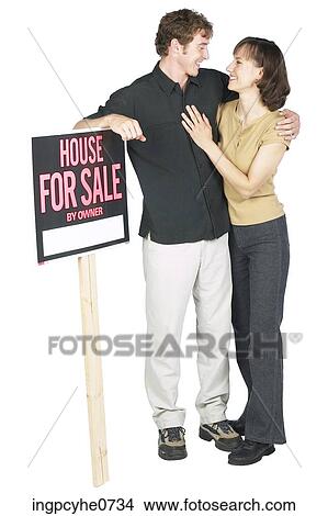 Man and woman with sign View Large Photo Image Picture - Man and woman with sign . Fotosearch