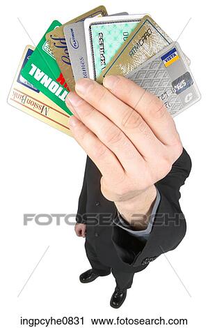 Stock Image - Man holding up credit cards . Fotosearch