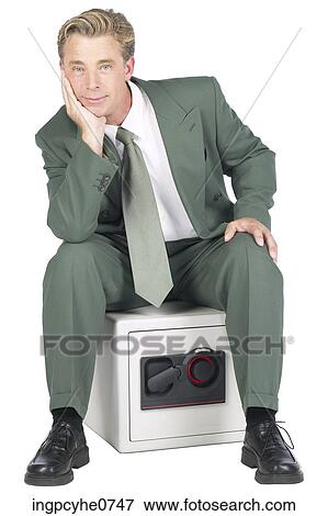 Man Sitting on Safe BE View Large Photo Image Stock Photo - Man Sitting on Safe BE . Fotosearch