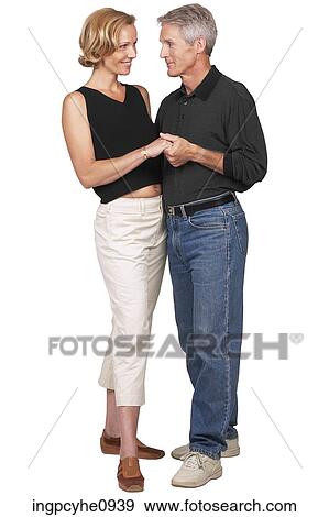 Middle aged couple holding hands and looking at each other View Large Photo Image Stock Photo - Middle aged couple holding hands and looking at each other . Fotosearch