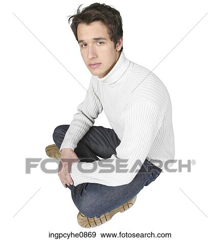 Stock Photo - Sad male sitting with legs crossed . Fotosearch
