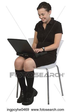 Smiling woman working on laptop View Large Photo Image Stock Photo - Smiling woman working on laptop. Fotosearch