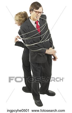 Struggling businesspeople tied together with elect L View Large Photo Image Stock Image - Struggling businesspeople tied together with elect L . Fotosearch
