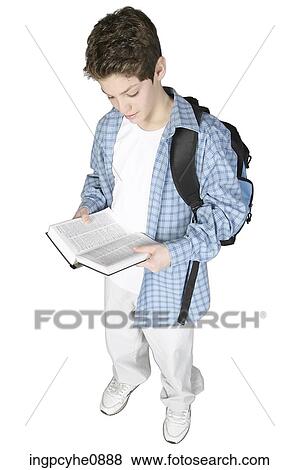 Teenaged boy carrying book bag and reading book View Large Photo Image Stock Photo - Teenaged boy carrying book bag and reading book. Fotosearch