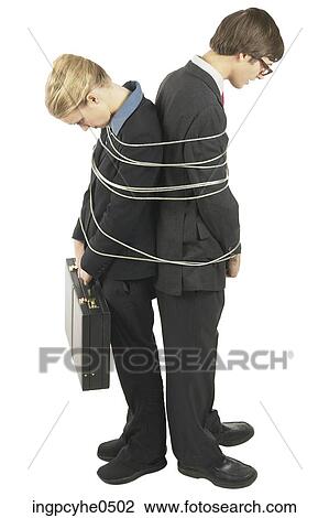 Two businesspeople tied together L View Large Photo Image Stock Image - Two businesspeople tied together L . Fotosearch