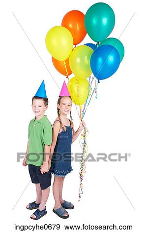 Stock Photo - Two children holding balloons . Fotosearch