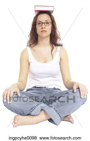 Woman balancing book on her head View Large Photo Image Stock Photo - Woman balancing book on her head . Fotosearch
