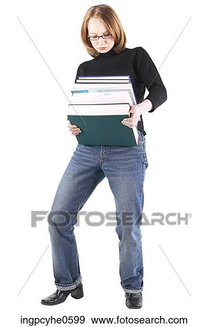 Woman carrying books View Large Photo Image Stock Photo - Woman carrying books . Fotosearch