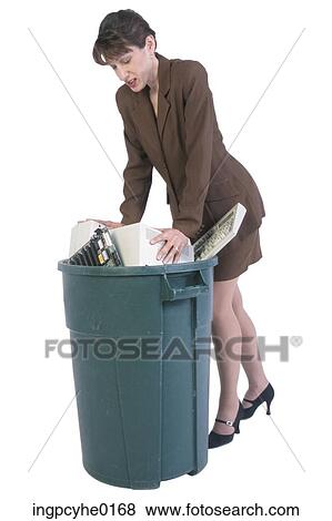 woman professional stuffing computer in garbage View Large Photo Image Stock Photo - woman professional stuffing computer in garbage. Fotosearch