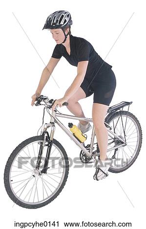 woman ridding a bicycle View Large Photo Image Stock Image - woman ridding a bicycle . Fotosearch