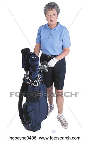 Stock Photograph - Woman with golf clubs . Fotosearch