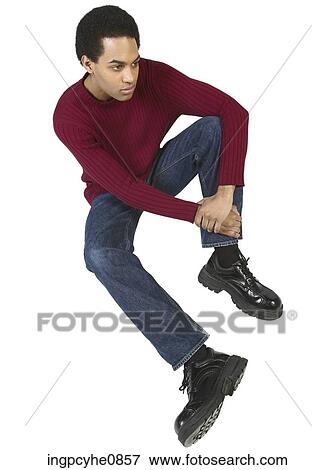 Young adult sitting View Large Photo Image Stock Photo - Young adult sitting. Fotosearch