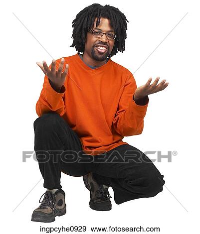 Young African American crouching on his heels View Large Photo Image Stock Photo - Young African American crouching on his heels . Fotosearch