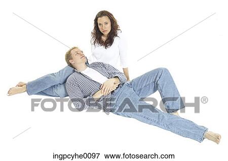 Young couple relaxing in jeans View Large Photo Image Stock Photo - Young couple relaxing in jeans . Fotosearch