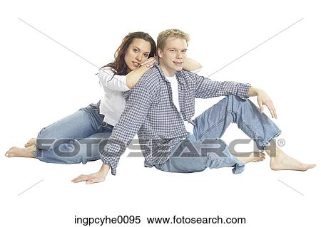 Young couple relaxing in jeans View Large Photo Image Stock Photography - Young couple relaxing in jeans . Fotosearch