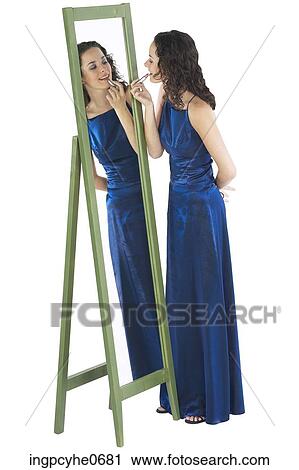 Young woman in blue evening dress View Large Photo Image Stock Image - Young woman in blue evening dress . Fotosearch