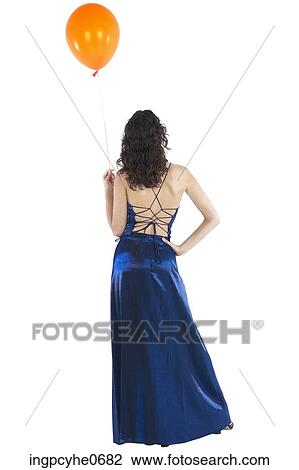Stock Image - Young woman in blue evening dress . Fotosearch