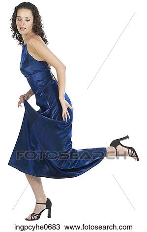 Stock Image - Young woman in blue evening dress . Fotosearch
