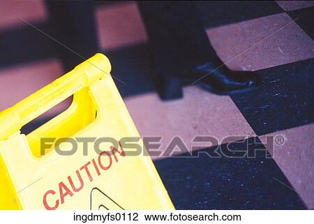 Boots on Checkered Floor wth Caution Sign View Large Photo Image Stock Image - Boots on Checkered Floor wth Caution Sign. Fotosearch