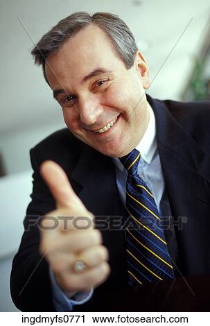 Businessman Giving a Thumbs-Up View Large Photo Image Stock Image - Businessman Giving a Thumbs-Up. Fotosearch