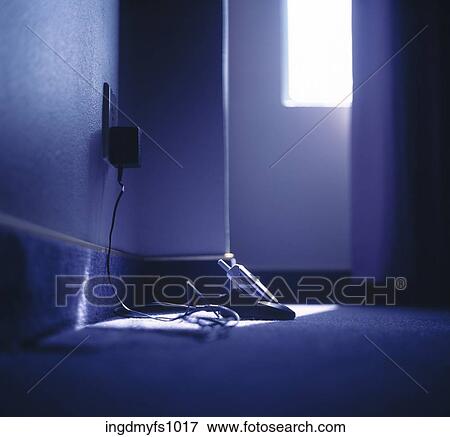 Cell Phone Charging on the Floor View Large Photo Image Stock Photo - Cell Phone Charging on the Floor. Fotosearch