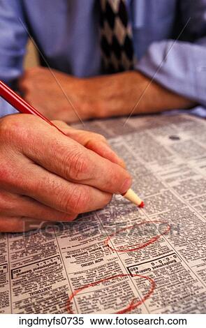 Circling Jobs in the Want Ads View Large Photo Image Stock Photography - Circling Jobs in the Want Ads. Fotosearch