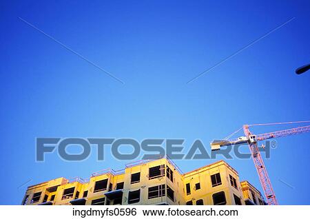 Constructing a Building with a Crane View Large Photo Image Stock Photograph - Constructing a Building with a Crane. Fotosearch
