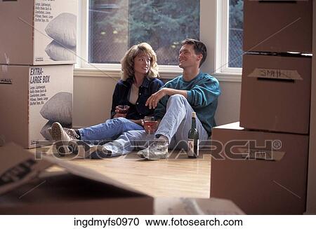 Couple Drinking Wine and Moving Into House View Large Photo Image Stock Image - Couple Drinking Wine and Moving Into House. Fotosearch