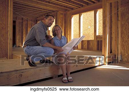 Couple Looking At Plans View Large Photo Image Stock Photography - Couple Looking At Plans. Fotosearch