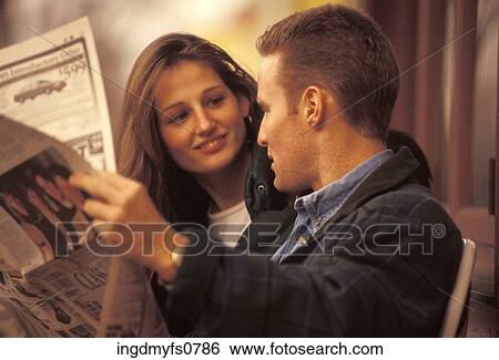 Couple Reading the Newspaper Together View Large Photo Image Stock Photograph - Couple Reading the Newspaper Together. Fotosearch