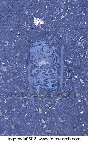 Stock Image - Crushed Cell Phone Faceplate. Fotosearch