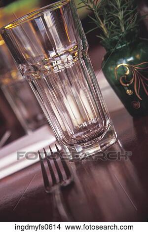 Fork and Glass on a Table View Large Photo Image Picture - Fork and Glass on a Table. Fotosearch