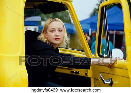 Stock Photo - Girl in Yellow Truck. Fotosearch
