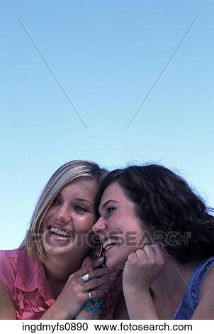 Girls Talking on a Cell Phone Together View Large Photo Image Stock Image - Girls Talking on a Cell Phone Together. Fotosearch