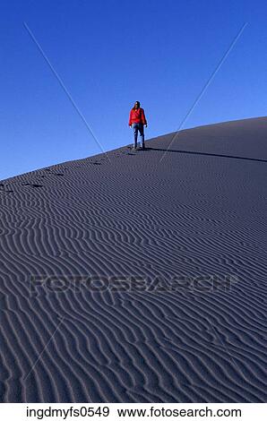 Stock Photo - Hiking the Sand Dunes. Fotosearch
